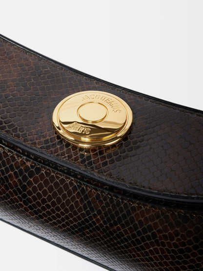 Jacquemus The Ovalo Clutch in Dark Brown